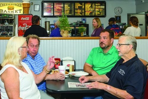 Talking with neighbors at Mathias Sandwich Shop