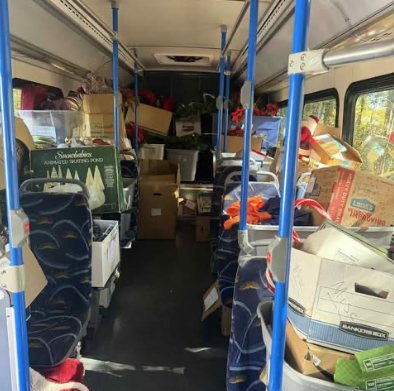 Inside the bus: decorations and supplies stacked in the aisle