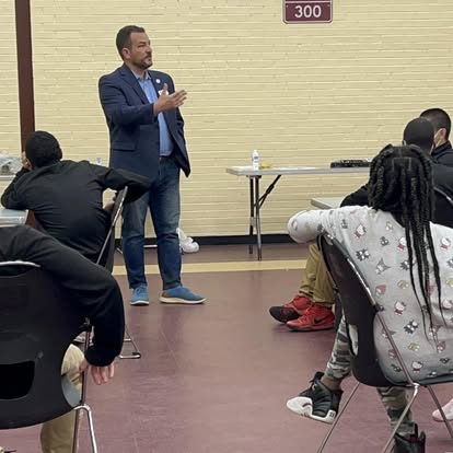 Gabriel Penfield speaking to a room of students