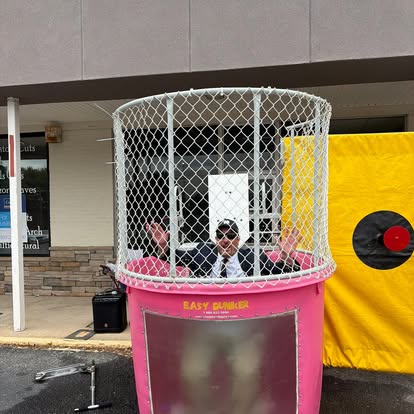 Gabriel Penfield sitting in a dunk tank